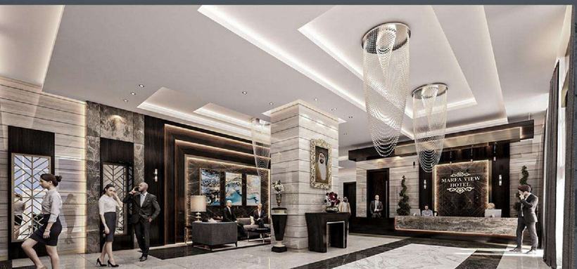 Al Marfa View Hotel lobby — cascading crystal chandeliers over book-matched marble, Abu Dhabi