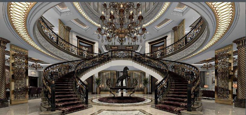 Al Salt Palace grand hall — twin curved staircases around a bronze sculpture